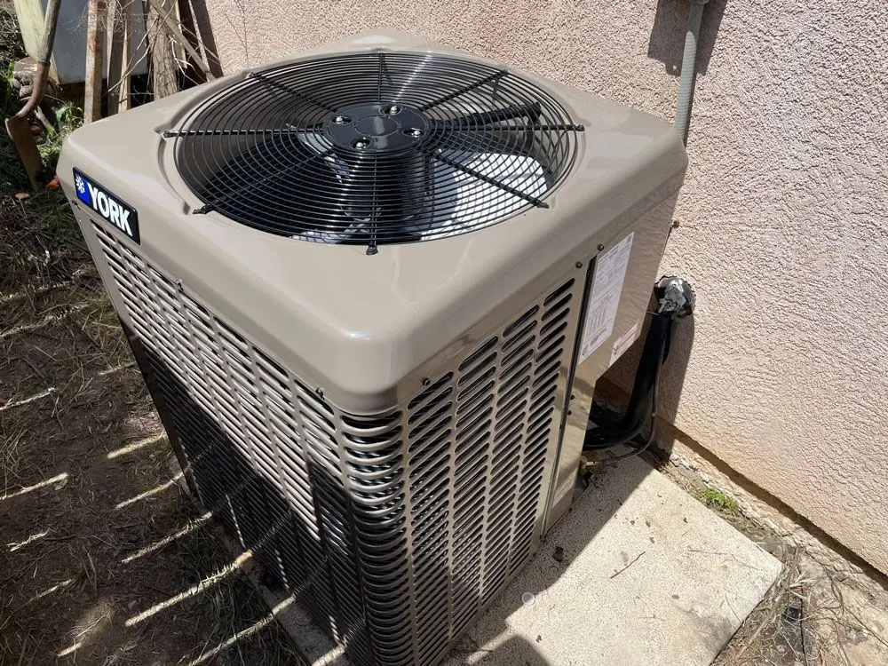 HVAC maintenance technician inspecting an aging system in Citrus Heights, CA